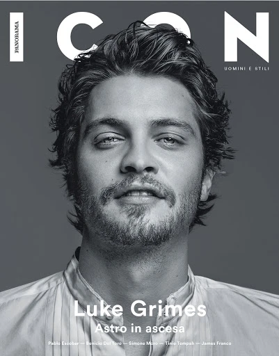 Black and white magazine cover featuring a close-up portrait of actor Luke Grimes. The magazine title, ICON, is in large white font.
