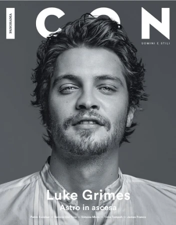 Black and white magazine cover featuring a close-up portrait of actor Luke Grimes. The magazine title, ICON, is in large white font.