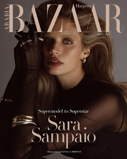Fashion magazine cover featuring Sara Sampaio with beige Harper's Bazaar masthead and gold jewellery against a soft grey background.