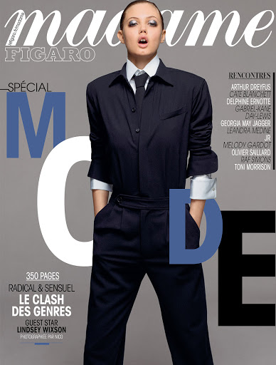Magazine cover featuring Lindsey Wixson in tailored suit with tie, against a neutral gray backdrop, with the 'Madame Figaro' masthead.