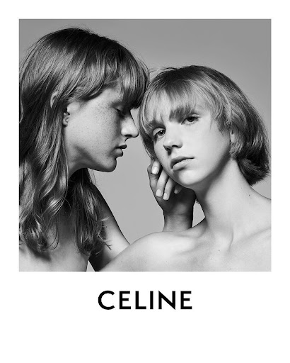 Black and white studio portrait of two young, bare-chested people with short haircuts, soft lighting, and the brand name CELINE below.