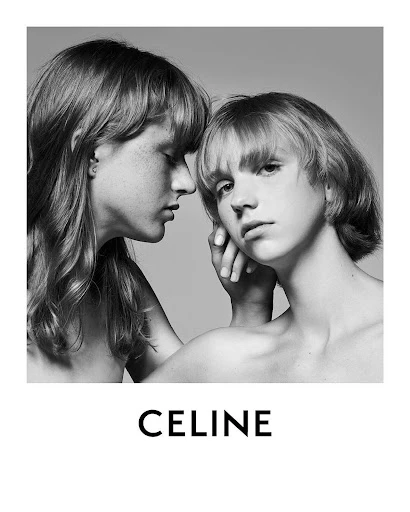 Black and white studio portrait of two young, bare-chested people with short haircuts, soft lighting, and the brand name CELINE below.