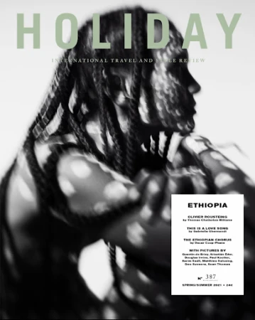 Black and white portrait of a person with braided hair patterned by dappled light shadows for a magazine cover.