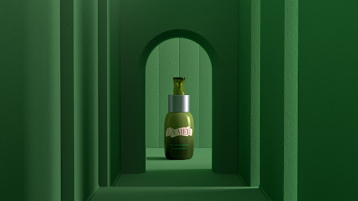 Olive-green bottle of La Mer Renewal Oil set against a matching green tunnel-like backdrop with soft lighting for beauty advertising.