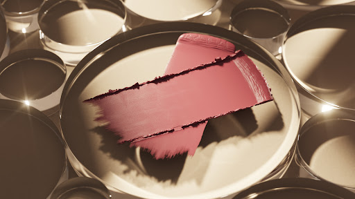 Cosmetic smear sample on clear circular pedestals, creating an abstract display with soft, diffused lighting.