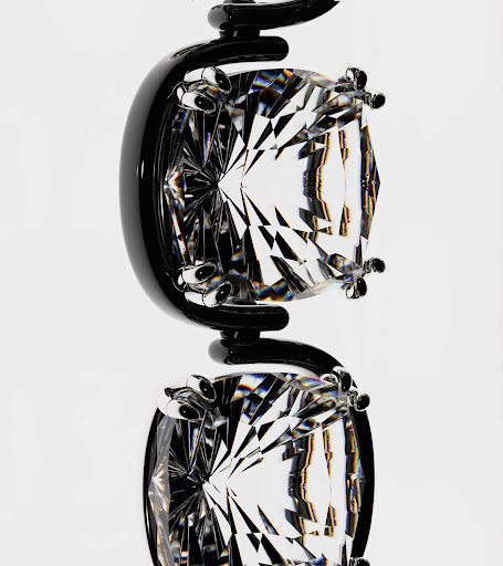 Macro shot of a black metal jewelry display featuring two clear faceted gemstones suspended in a white background, highlighting geometric shapes.