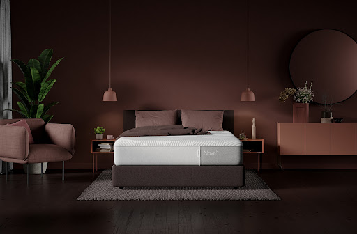 Bedroom scene featuring a plush mattress atop a platform bed, complemented by bedside tables, a sideboard, and a serene color palette.