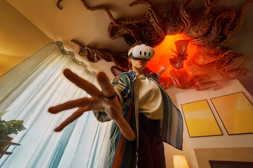 A woman wearing a virtual reality headset stands in a living room, reaching out with her hand, with a sci-fi portal behind her.