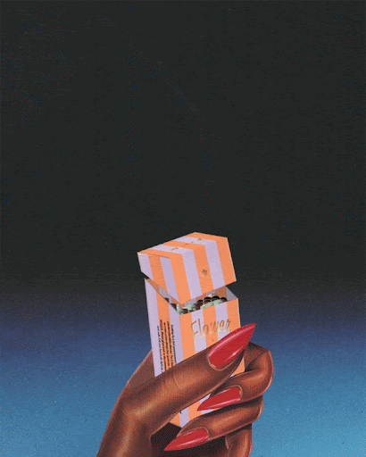 Hand holding a peach-striped box of chocolates against a blue and black backdrop in a studio shot with red fingernails.