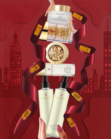 Cosmetic products by Elizabeth Arden, including skincare and anti-aging serums, are displayed with taxi cab accents and NYC backdrop.