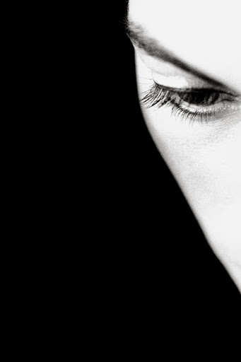 Extreme close-up monochrome portrait of a person eye and brow by Ralph Gibson