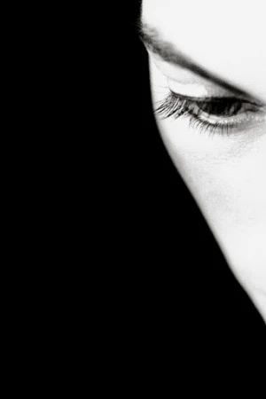 Extreme close-up monochrome portrait of a person eye and brow by Ralph Gibson