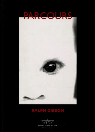 Black and white book cover featuring a close-up partial image of a child's face and eye, with title and author text.