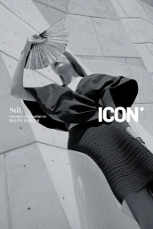 Black and white portrait of a woman holding a hand fan over her face against a concrete architectural wall by Ralph Gibson.
