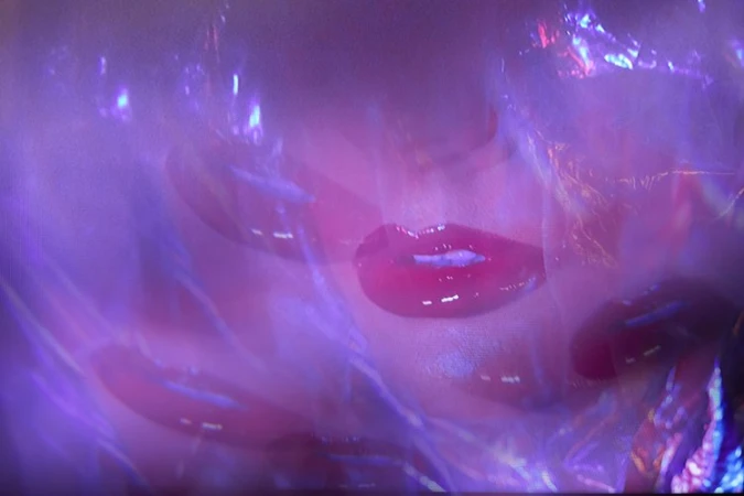 Abstract portrait with multiple layered exposures of red lips and purple iridescent light effects by Viviane Black
