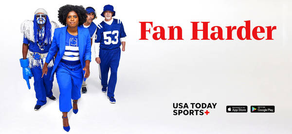 Group of four people including a woman in a blue suit and others in sports fan costumes stand on a white background promoting sports.