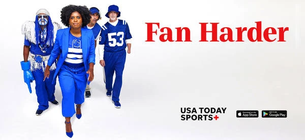 Group of four people including a woman in a blue suit and others in sports fan costumes stand on a white background promoting sports.