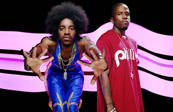 Portrait of André 3000 leaning forward with outstretched hands and Big Boi standing behind him in Los Angeles by Joseph Cultice