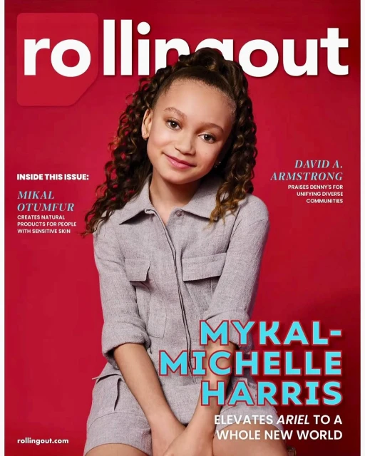 Magazine cover featuring Mykal-Michelle Harris in a jumpsuit against a red background, with Rolling Out magazine logo at the top.