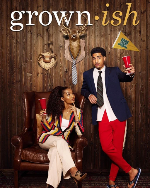Promotional shot of Yara Shahidi in an armchair and Trevor Jackson standing, against a wood-paneled wall for 'Grown-ish'.