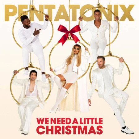 Five members of Pentatonix wearing white outfits posed inside golden ornament hoops hanging against a seamless white background.