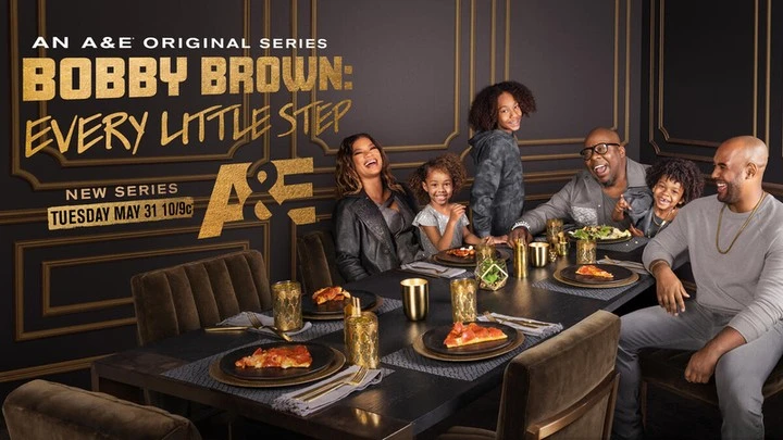 Promotional image for 'Bobby Brown: Every Little Step' features Bobby Brown and his family at a dining table with pizza and drinks.