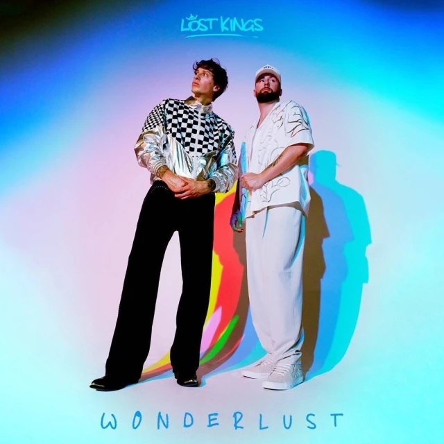 Music album cover featuring two musicians, one in a checkerboard jacket and another in white, posing against a blue and white gradient background.