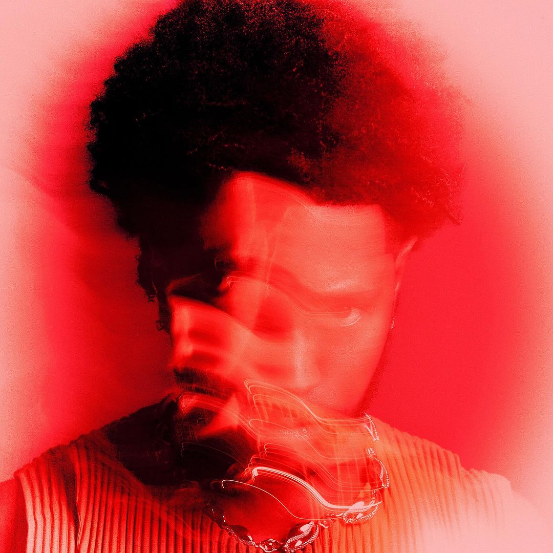 Portrait of a Black man with a motion-blurred red overlay and dark textured hair against a bright red background.
