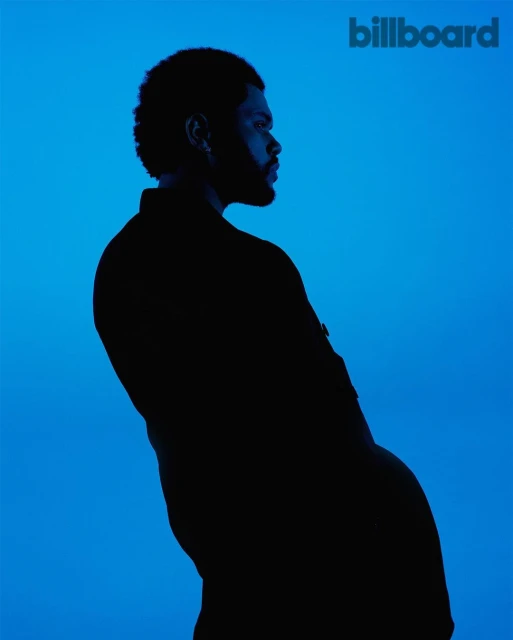 Portrait of an adult male silhouette against a blue background with the Billboard logo in the upper right corner.