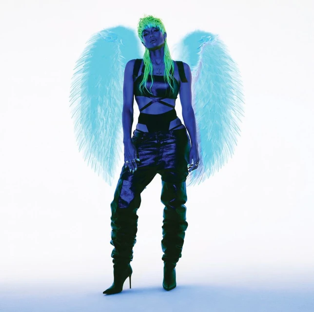 Full-length shot of woman with green hair, dark outfit, wings, and high heels against a white background. Fashion and beauty shot.