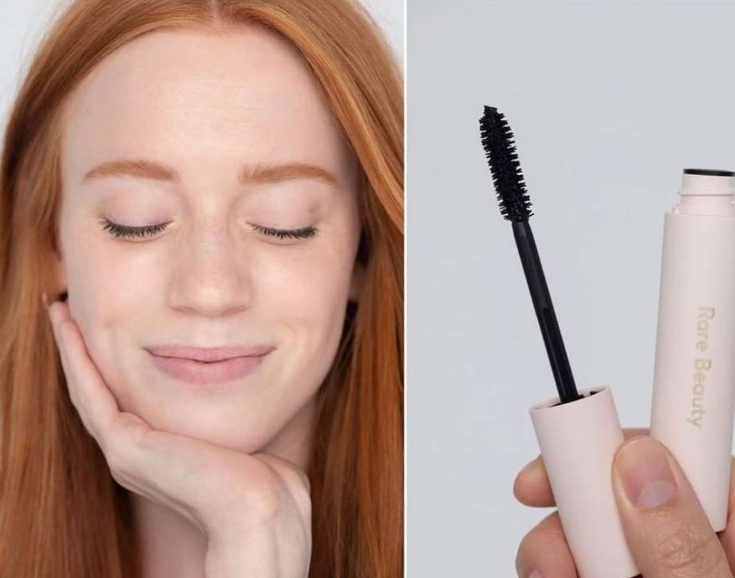 Redhead woman with eyes closed poses next to mascara. Makeup for beauty concept in soft studio lighting; fashion and cosmetics.