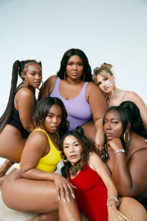 Group of six diverse female models wearing colourful swimsuits posing against a light background by Bonnie Nichoalds