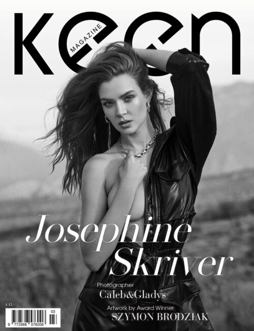 Black and white magazine cover featuring Josephine Skriver in a black leather jumpsuit against an outdoor landscape background.