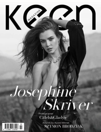 Black and white magazine cover featuring Josephine Skriver in a black leather jumpsuit against an outdoor landscape background.