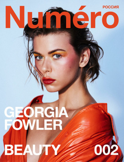 Magazine cover featuring Georgia Fowler with vibrant makeup, an orange jacket, and the magazine title 'Numero' in bold orange text.