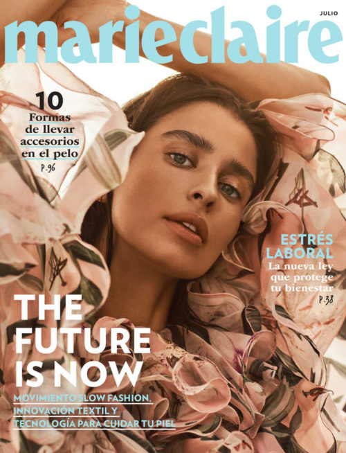 Marie Claire magazine cover featuring a woman with light brown hair and light skin wearing a ruffled floral top looking at the camera.
