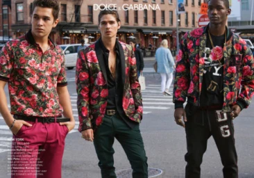 Three male models in floral print Dolce and Gabbana attire posing together on a New York street corner.