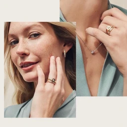 Close-up portrait of a woman wearing gold rings, a delicate necklace, and earrings, photographed by Justin Wilczynski.