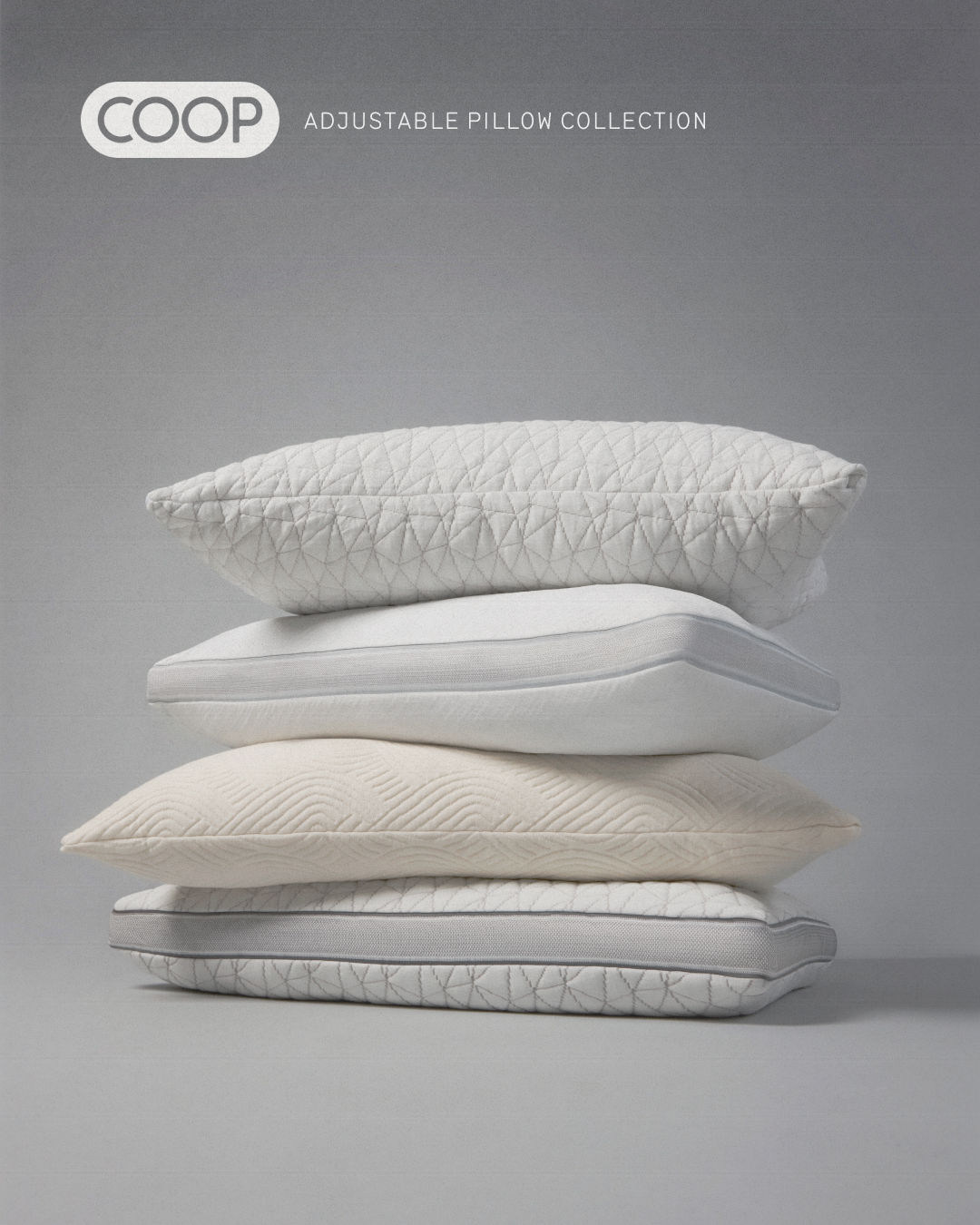 A stack of four Coop adjustable pillows on a gray background. Pillows have textures and gray trim. Coop logo is visible at top left.