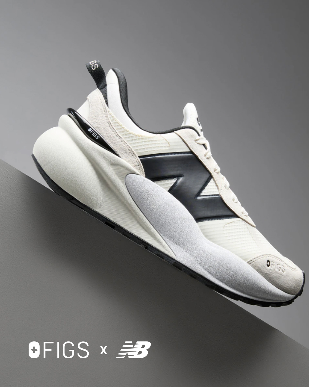 Studio shot of a New Balance x OFIGS sneaker featuring black logo and white colourway against a gradient grey background.