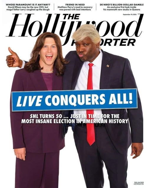The Hollywood Reporter magazine cover with two people dressed as political figures, one giving a thumbs up, against a white backdrop.
