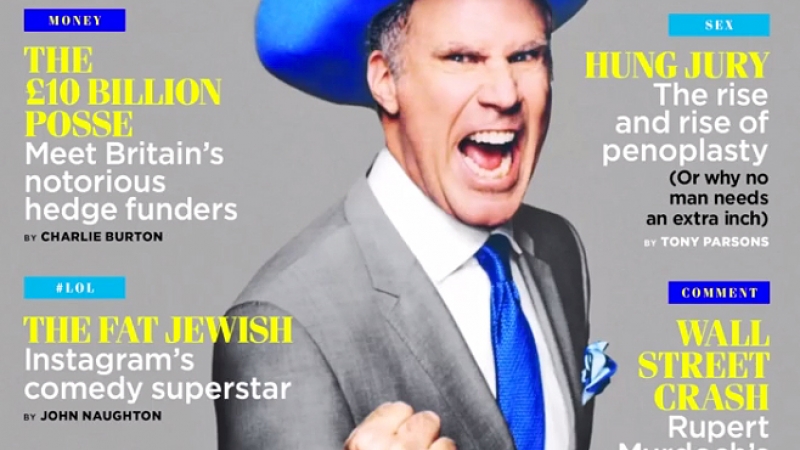 Magazine cover featuring a male celebrity with an open mouth, wearing a grey suit, blue hat, and tie against a grey background.