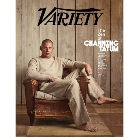 Channing Tatum lounges barefoot in an armchair on a Variety magazine cover, in a light-filled studio with a rustic wood backdrop.
