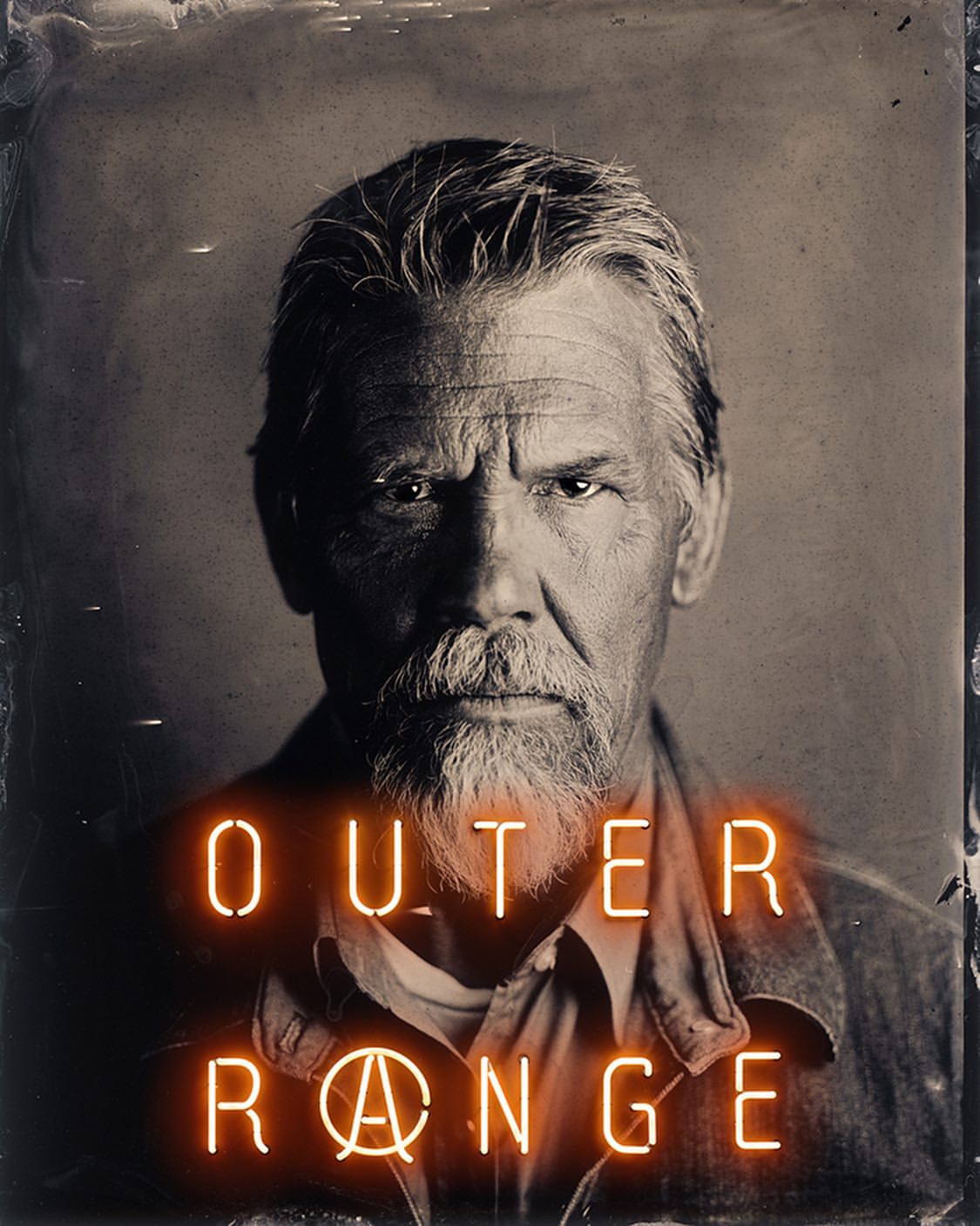 Portrait of an adult male with a gray beard and gray hair, set against a distressed background, with neon text overlay reading 'Outer Range'.