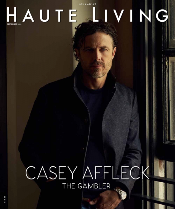 Magazine cover of Haute Living featuring Casey Affleck wearing a dark coat, captured in a medium shot with natural window lighting.