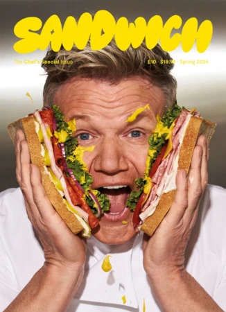 Gordon Ramsay holding halves of a large sandwich against his face, photographed by Brian Bowen Smith