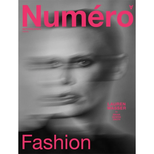Numéro Netherlands magazine cover featuring a blurred portrait of model Lauren Wasser in a grayscale color palette with pink text.