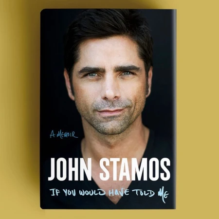 Book cover featuring John Stamos; headshot, black background, book title 'John Stamos If You Would Have Told Me.'