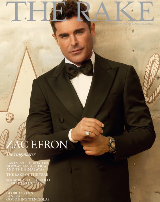 Zac Efron on the cover of The Rake magazine, wearing a black tuxedo and bow tie, with a focus on classic elegance and high fashion.