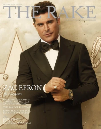 Zac Efron wearing a black double-breasted tuxedo and bow tie photographed by Brian Bowen Smith for The Rake magazine cover.